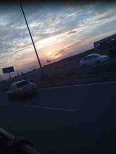 A Moment Stops Still When The Day Says Goodbye & The Night Is Still To Come By Love The Roads , The Sky, The Golden Clouds & The Fast Moving Cars