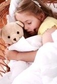 5253764-portrait-of-cute-little-girl-sleeping-with-teddy